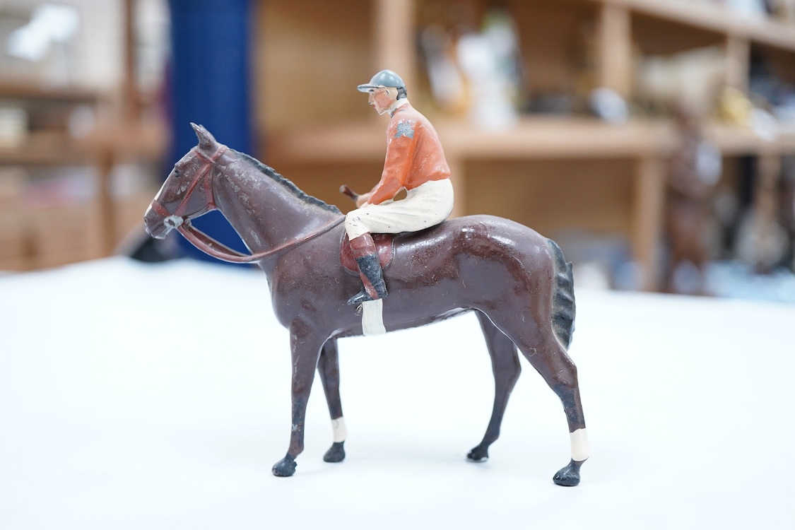 Two boxed Britains Racing Colours of Famous Owners series lead mounted figures; Miss Dorothy Paget - rider in yellow-striped blue jersey on a grey horse, and Msr. M. Boussac - rider in orange jersey on a dark brown horse